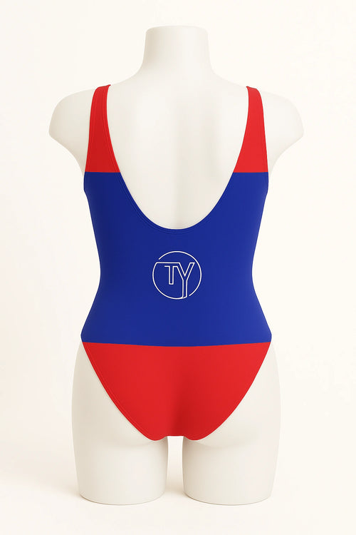Back view of women's one-piece swimsuit inspired by the Belize flag